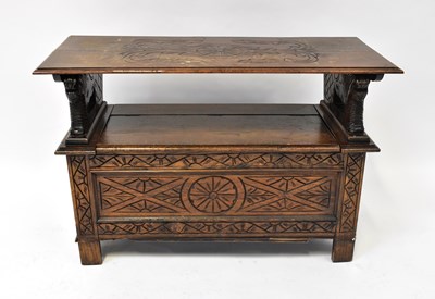 Lot 44 - A mid-20th century carved oak monks' bench,...