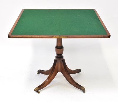 Lot 65 - A George III mahogany fold-over card table...