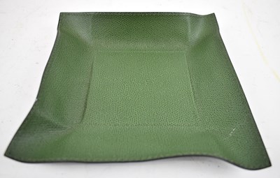 Lot 380 - DAVID LINLEY; a mouldable green leather clad...