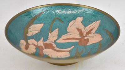 Lot 389 - A brass dish, decorated with enamelled flowers,...