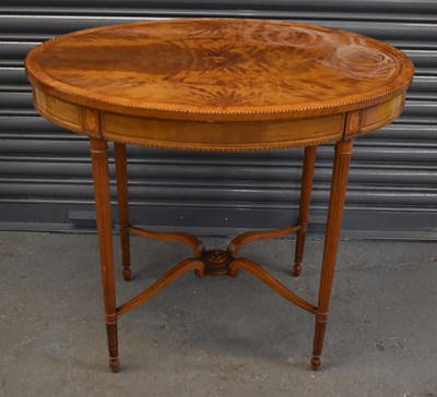 Lot 47 - An Edwardian inlaid satinwood oval side table...