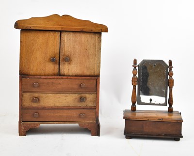 Lot 382 - A Victorian walnut miniature linen press, the...