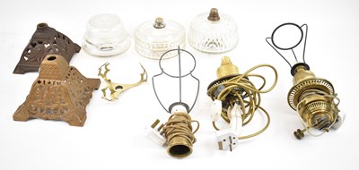 Lot 141 - A quantity of oil lamp parts, to include three...