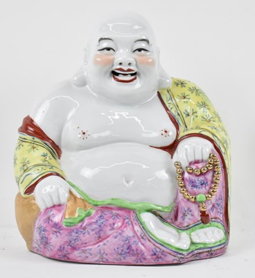 Lot 652 - A Chinese porcelain figure of laughing Buddha,...