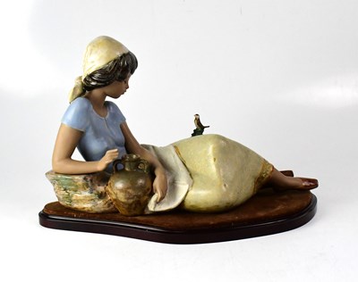 Lot 341 - LLADRÓ; a matte finish figure of a reclining...