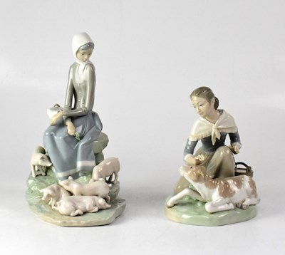 Lot 253 - LLADRÓ; two figure groups of young ladies...