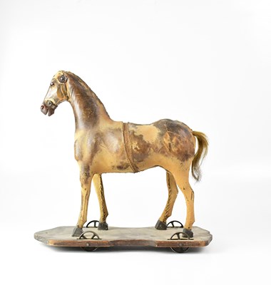 Lot 200 - A Victorian leather-clad pull-along horse with...