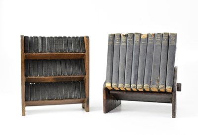 Lot 804 - A three-tier open bookshelf containing forty...