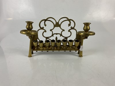 Lot 285 - A brass menorah, height 16cm, with a large...