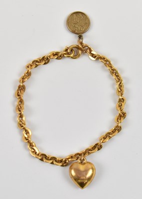 Lot 805 - A 9ct yellow gold bracelet with 9ct yellow...