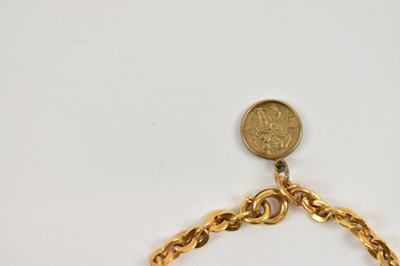 Lot 805 - A 9ct yellow gold bracelet with 9ct yellow...