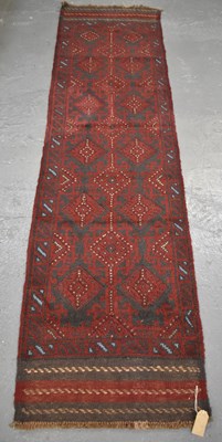 Lot 101 - A hand made woollen Meswani runner, 253 x 60cm.