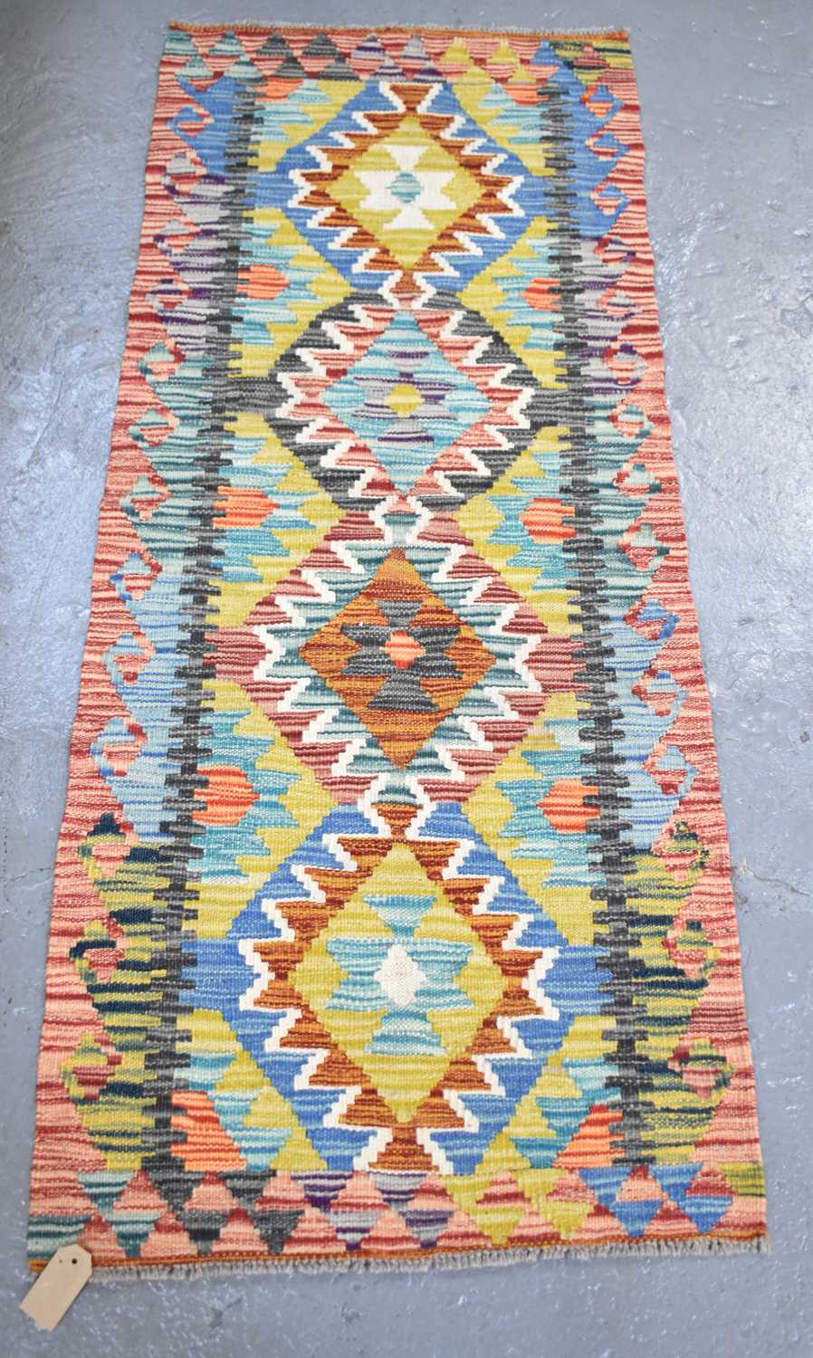 Lot 106 - A handmade woollen Chobi Kilim runner, 150 x...