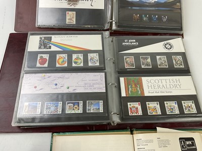Lot 6032 - Two albums of Royal Mint First Day Covers,...