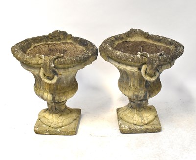Lot 98 - A pair of reconstituted stone urns of...