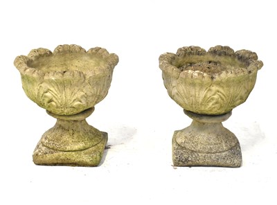Lot 96 - A pair of reconstituted stone urns of small...
