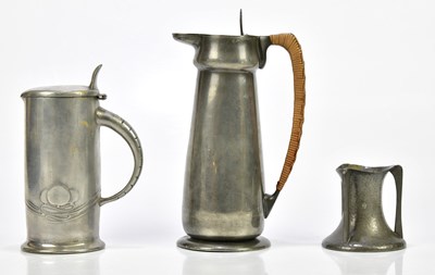 Lot 313 - ARCHIBALD KNOX FOR ENGLISH PEWTER; a water jug...