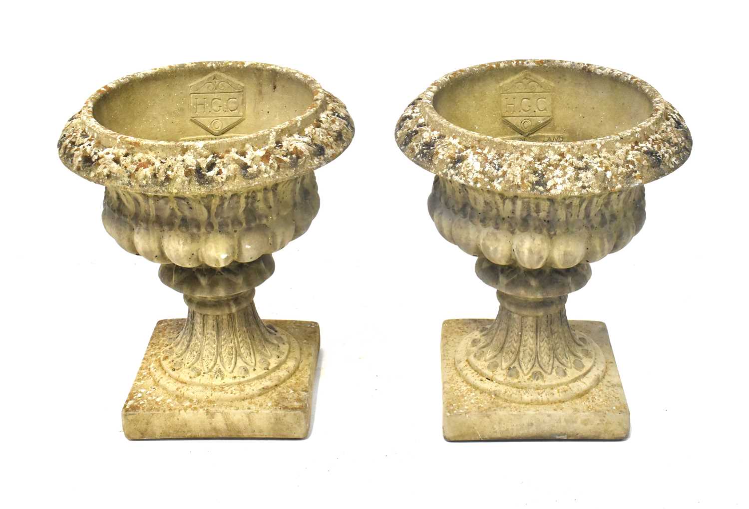 Lot 97 - A pair of reconstituted stone garden urns of...