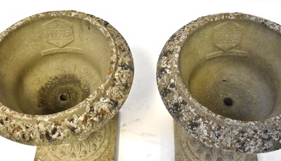 Lot 97 - A pair of reconstituted stone garden urns of...