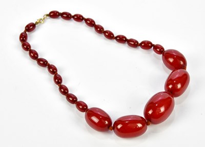 Lot 1034 - A cherry amber coloured necklace, approx...