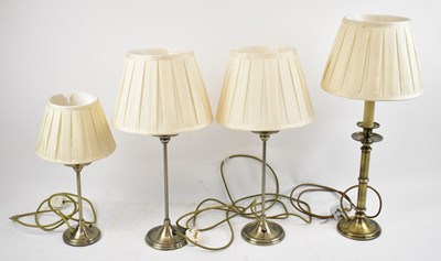 Lot 144 - A pair of modern brass effect table lamps,...