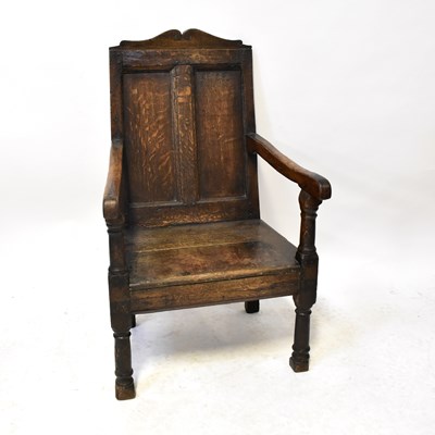 Lot 71 - An 18th century oak open arm elbow chair...