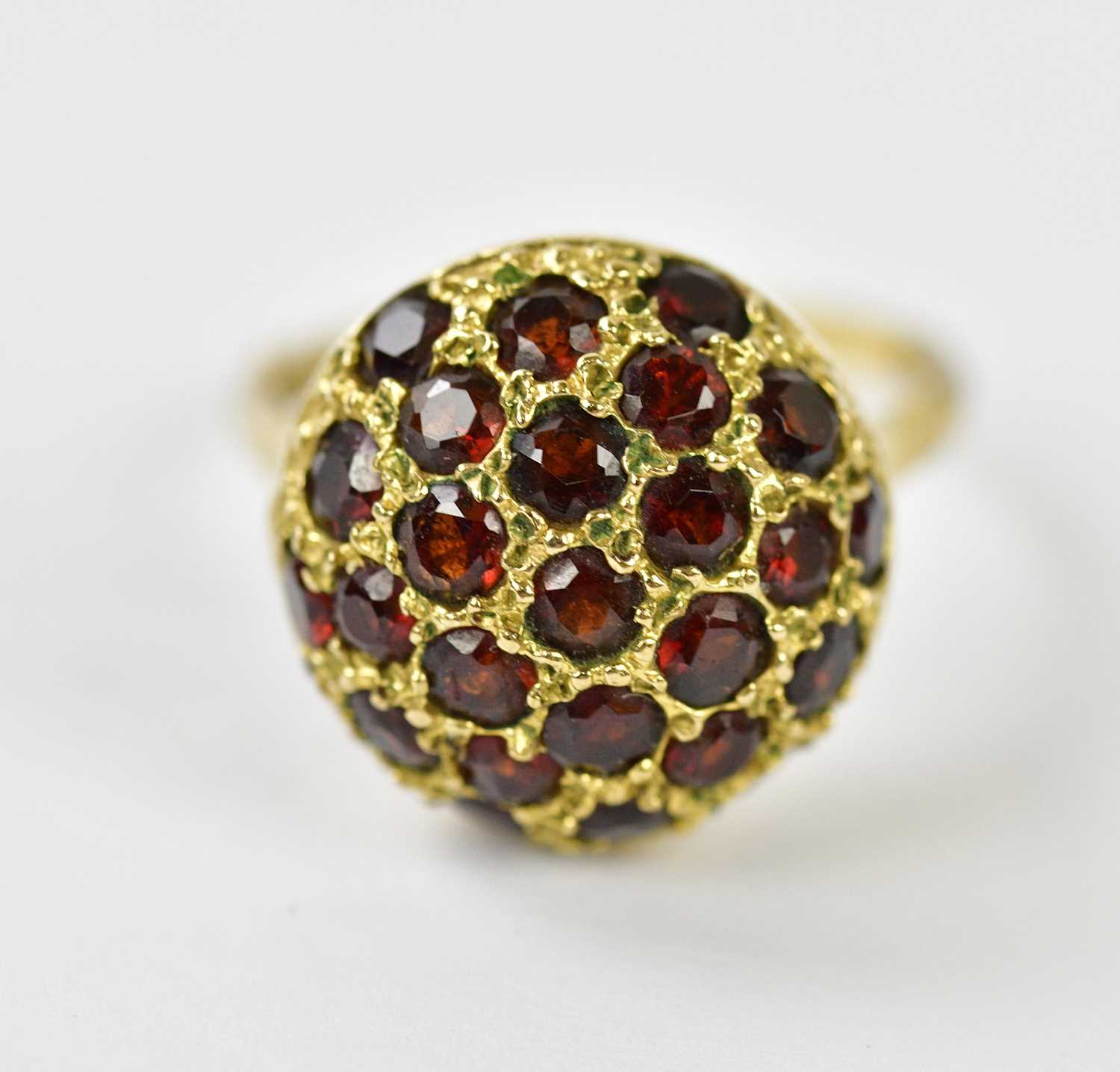 Lot 297 - A 9ct yellow gold garnet set dress ring,