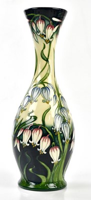 Lot 102 - MOORCROFT; a large vase decorated in the...