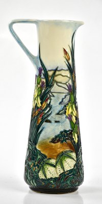 Lot 128 - MOORCROFT; a ewer decorated in the 'Islay'...