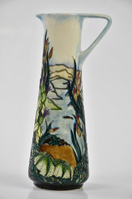 Lot 128 - MOORCROFT; a ewer decorated in the 'Islay'...