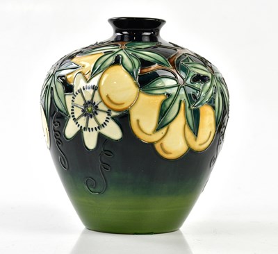 Lot 105 - MOORCROFT; a bulbous vase decorated in the...