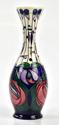 Lot 127 - MOORCROFT; a baluster vase with flared neck,...