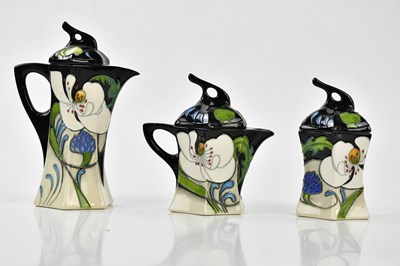 Lot 65 - MOORCROFT; a rare and unusual 'Au Lait' eleven...