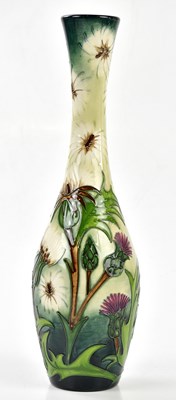 Lot 122 - MOORCROFT; a baluster shaped vase with...