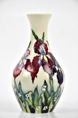 Lot 124 - MOORCROFT; a baluster shaped vase decorated in...