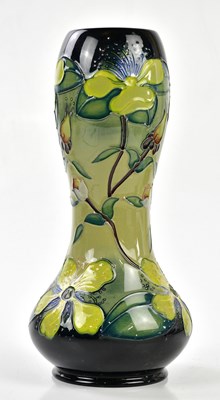 Lot 131 - MOORCROFT; a double gourd vase decorated in...