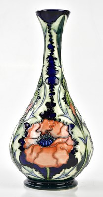 Lot 104 - MOORCROFT; a large baluster vase, decorated in...