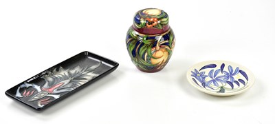 Lot 117 - MOORCROFT; a ginger jar and cover in the...