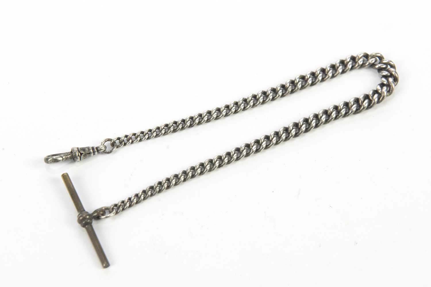 Lot 3039 - A hallmarked silver watch chain and T-bar,...