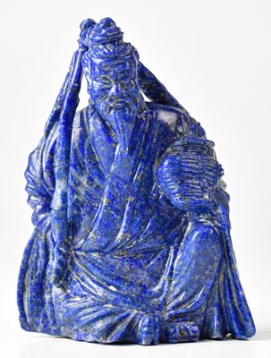 Lot 399 - A Chinese carved lapis lazuli figure of a...