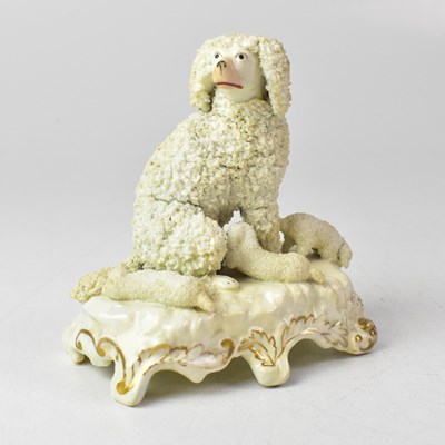 Lot 375 - A 19th century Staffordshire model of a poodle...