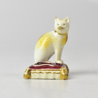 Lot 408 - ROCKINGHAM; a c.1830 porcelain model of a cat...