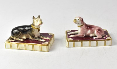 Lot 412 - ROCKINGHAM; a pair of models of recumbent dogs...