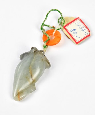 Lot 1042 - A Chinese grey jade carving of a squid with...