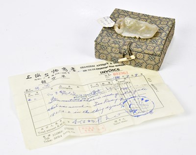 Lot 1043 - A Chinese jade carving of a cat lying upon a...