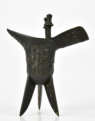 Lot 1129 - A Chinese bronze jue of archaic form, height...