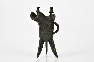 Lot 1129 - A Chinese bronze jue of archaic form, height...