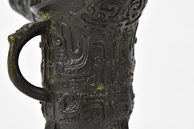 Lot 1129 - A Chinese bronze jue of archaic form, height...