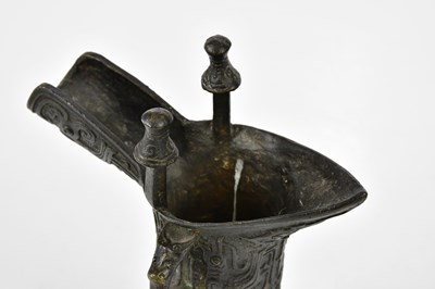 Lot 1129 - A Chinese bronze jue of archaic form, height...