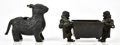 Lot 1133 - A Chinese bronze figural bowl with central...